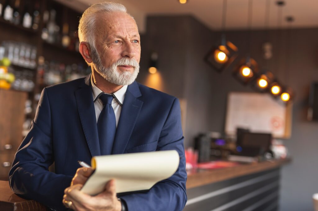 Restaurant manager signing contracts